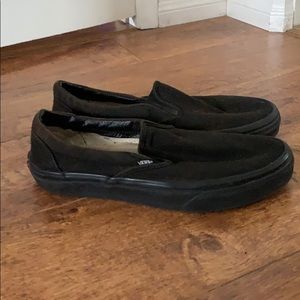 All black slip on vans